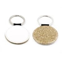 Llaveros de símil piel dorado con purpurina (varias formas)