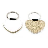 Llaveros de símil piel dorado con purpurina (varias formas)